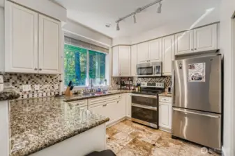 Stylish kitchen with granite counters and modern finishes.