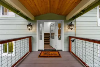 Welcoming covered main entrance to the home completed in 2025 with easy to maintain and forever lasting Trex decking