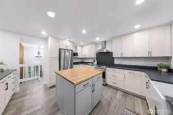 Large open kitchen, plenty of space for all your cooking and entertaining needs! Beautiful butch block accent island with storage. All new stainless steel appliances and gas range!