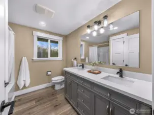 Large full guest bath with dual vanity with quartz counter tops lots of storage with linen closet too!