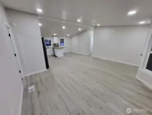 We are heading back out into the main living area -- we came from the doorway on the left side of the photo. Heading across to the bright hallway