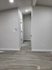 Bright hallway we are about to enter; featuring bedrooms #2 & #3, and 2nd bath, which is a 3/4 bath w/ shower