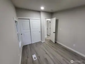 As promised; view from the corner between the 2 windows, showing off the closet in bedroom #3, featuring quiet, sliding doors and a super high ceiling inside! This is the last photo for now (12/23). More to come soon! Check back or come see it yourself!