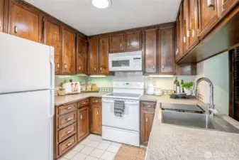Kitchen has an abundance of storage.