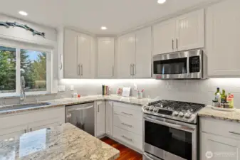 Bright kitchen with under cabinet lighting.