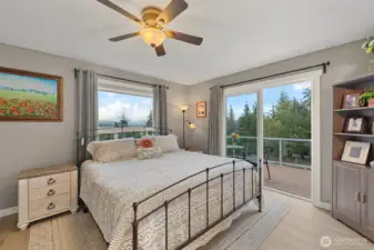 Primary Bedroom with deck off slider. Views of sound and Mount Baker!