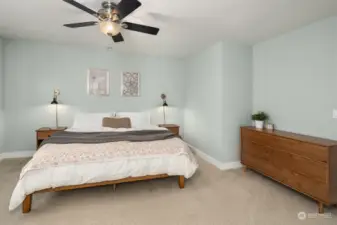 A ceiling fan in the bedroom offers added comfort.