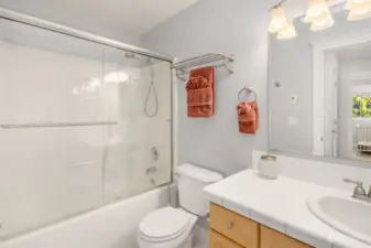 Full bath with tub/shower combo.