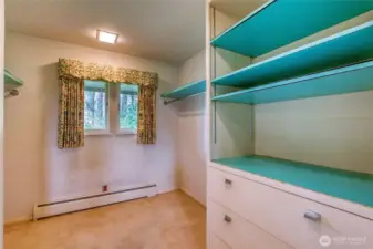 The second primary ensuite bedroom has another walk-through closet to a full bathroom.