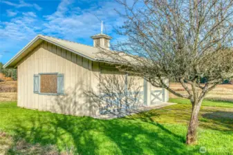 The detached three-bay garage with room for storage.