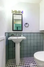 Modern remodeled half bath.