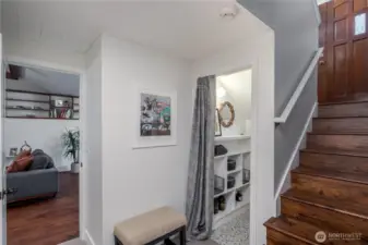 Downstairs wine closet under staircase
