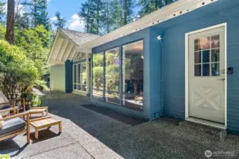 Tucked just off the main walkway, this convenient side entry leads directly into the kitchen—ideal for unloading groceries or stepping out to relax on the patio.