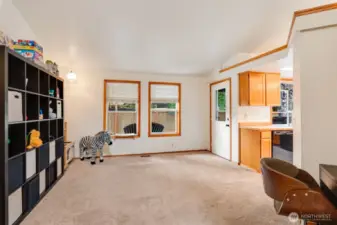 Flexible bonus space off the kitchen—perfect as a playroom, home gym, or second living area.