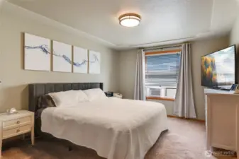 Enjoy morning light and privacy in this comfortable and airy Primary Bedroom retreat, complete with decorative ceilings and plush carpeting.