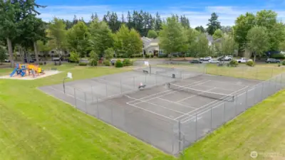 Enjoy neighborhood amenities like this community tennis and basketball court—just a short stroll from home.
