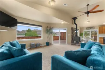 Living room adjacent the kitchen with access to the deck through slider with Lakeview.