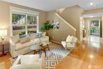Entry hall opens to the bright living room with bamboo floors