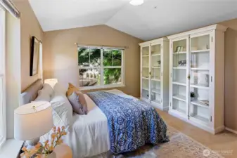 Upstairs - this is room 2 of three. Vaulted ceilings. These two shelving unit/cabinets stay with the condo.
