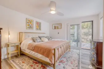 Large primary bedroom with the new sliders installed for easy access to backyard.