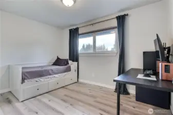 Third bedroom with updated flooring and flexible space for guest room, office, or hobby room.