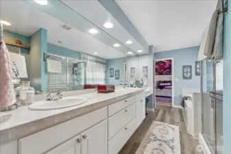Primary bath separate soaking tub and standalone shower.
