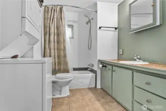 Full bathroom and utility room.