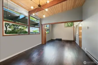 Large bedroom on main floor with bonus space used as a 4th bedroom.