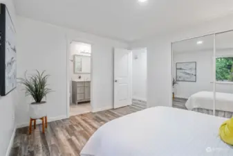The primary bedroom is a great size and has access to the main guest bath. Refreshed flooring throughout most of the house is this vinyl plank easy-to-maintain surface.