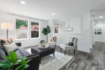 As you step inside this lovely split-level home, you will notice the new vinyl plan flooring and freshly painted walls, can lighting, and new lighting fixtures.