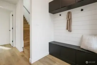 Formal Entry with Accent Wall and Built-In Bench and Cabinets