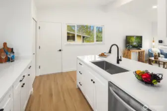 Kitchen with Quartz Breakfast Bar, Great Room to Right