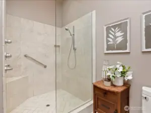Large walk-in travertine shower.