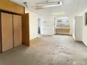 Items Virtually Removed. Detached Garage with cupboards, Shelving, Benches, and Shower Bathroom.