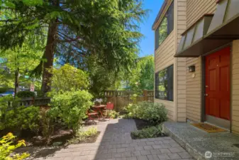 This lush patio is the perfect space for gardening, or just relaxing with a cup of coffee.