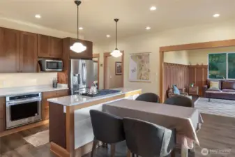 Stylish kitchen with quartz counters, stainless appliances, and an open layout flowing seamlessly into the living space.