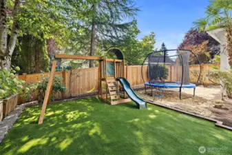 Turf Backyard with Playground and Trampoline