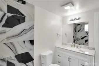 Beautifully updated vanity with plenty of counter space.
