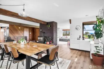 Seamlessly flow from the table, to a coffee nook, to the living space, all surrounded by windows.
