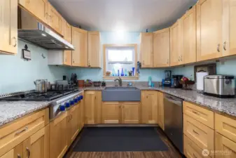 Kitchen is a cook's dream, with granite countertops, apron-front sink, custom maple cabinets, and more - all new in 2020!