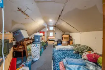 The remaining upstairs space is ready for your imagination - sitting room, office, closet space?  Seller intends to finish off the walls before closing.