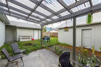 Covered back patio off the dining nook.  Awning is new in 2020.