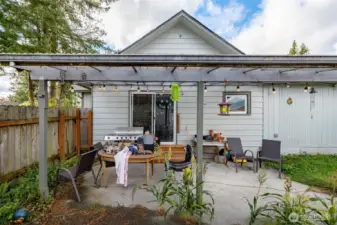 A look at the back of the house and covered patio, which is plumbed for gas (propane) BBQ