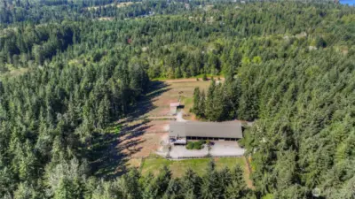 Within this 20 acres equestrian setting you will find 5 cleared acres with a thoughtful set up to host your equestrian friends! The remaining 15 wooded acres has marketable (50-year) timber - planted in 1975