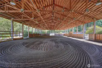 View looking to the East of the 60 X 120 X 16 covered arena. The 16' plate height is perfect to accommodate jumping. Two 12 X 12 entry gates and one service gate.