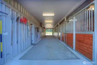 Looking from opposite end of barn down the 12 X 60 center aisle. The five stalls on the right (west side) have direct turn out.