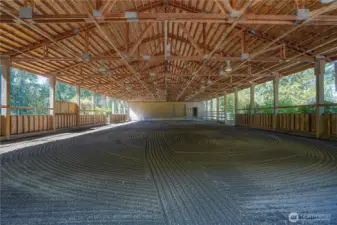 60 X 120 lighted covered arena with Pabco sand footing! Notice the garage type door on the far end of the arena. This can become an elevated viewing room and doubles as a loading dock.
