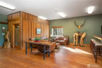 The spacious gathering room features a massive pantry/storage room