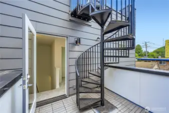 Spiral staircase to large rooftop deck