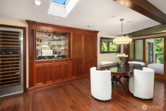 An entertainers delight - your guests will enjoy the open wet bar and perfectly chilled wine at hand. Custom cabinetry with hidden doors to put the bar away when the party is over.